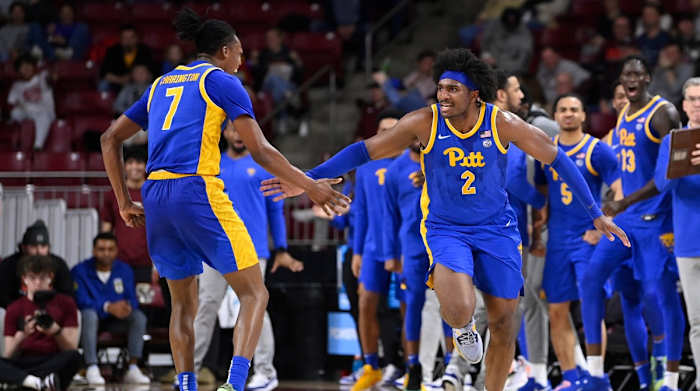  Pittsburgh Panthers forward Blake Hinson (2) and guard Carlton Carrington (7) react to game action during the second half at Conte Forum.